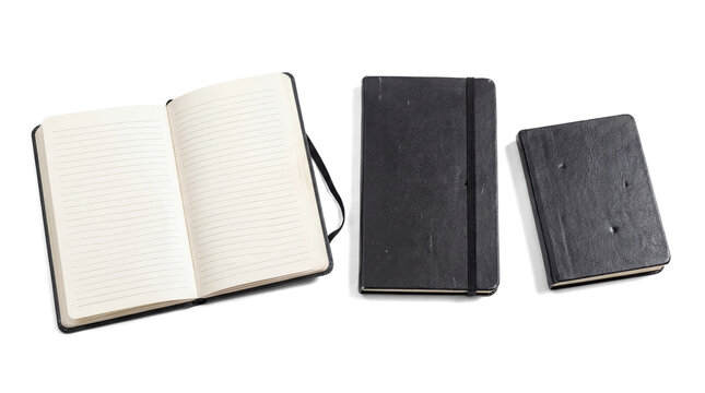 an open black lined notebook with a black elastic band and two closed black notebooks of different sizes, arranged on a transparent background.