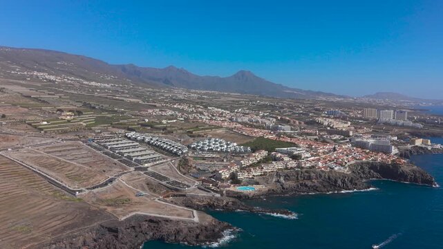 Volcanic coast and Callao Salvaje in Tenerife, aerial view, sunny day