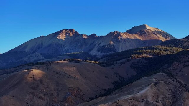 Sunlit Borah Peak towering above rugged range along Highway 93 in Idaho