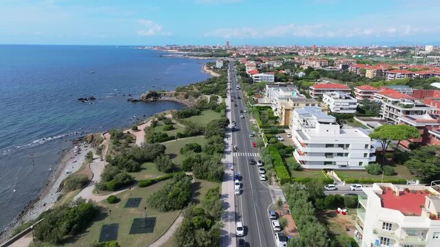 gorgeous low coastal drive perfectly down coastal shore road SS 1, in Livorno, Italy heading north to the ports