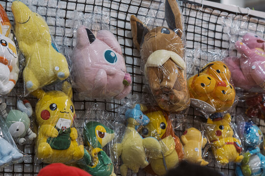 GUAYAQUIL, ECUADOR &ndash; AUG 06, 2023: Pokemon plush toys including Pikachu, Jigglypuff and Eevee displayed for sale at a pop culture collectibles stand during a Comic Con event