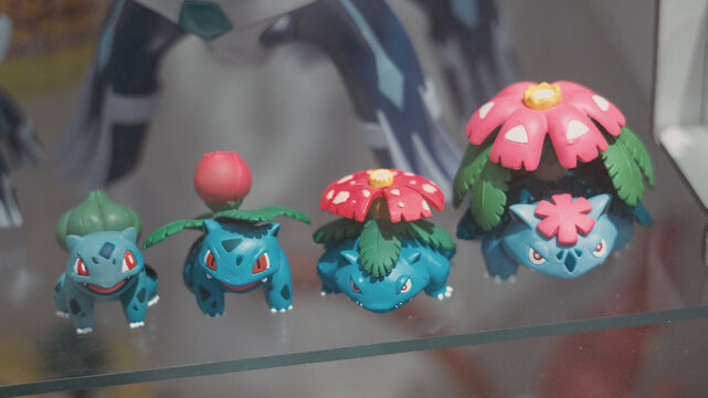 GUAYAQUIL, ECUADOR &ndash; AUG 06, 2023: Pokemon collectible figures showing the evolution line of Bulbasaur, Ivysaur and Venusaur displayed at a Comic Con collectors event
