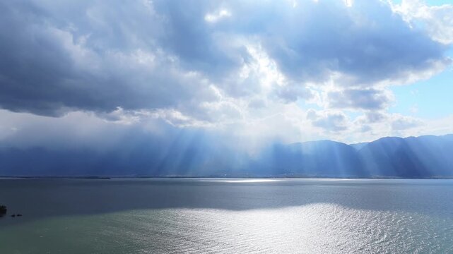 Erhai Lake Dali with Dramatic God Rays and Mountains