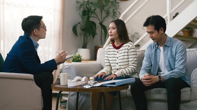 couples therapy session, a marriage counselor consults with a young couple for family therapy, offering relationship counseling, marriage help, family support, anxiety therapy, depression support	