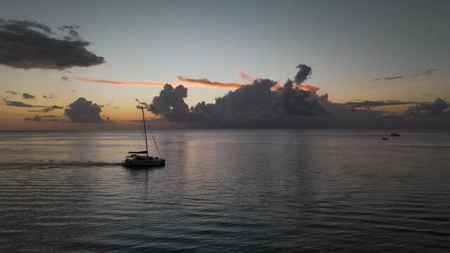 boat in Cozumel Quintana Roo Drone orbit right cloudy sunset