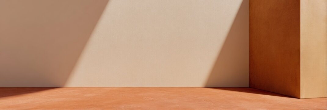Minimalist studio background featuring light and shadow play on wheat beige wall and terracotta floor for product presentation with copy space for aesthetic design