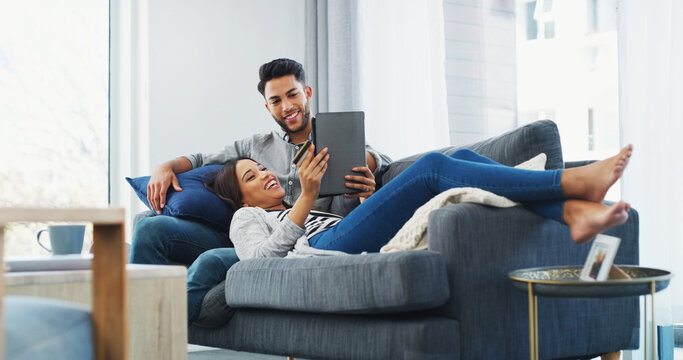 Happy couple, relax and online shopping with tablet on sofa for virtual payment or banking in home. Man, woman or shoppers with smile, credit card or technology for ecommerce, order app or purchase