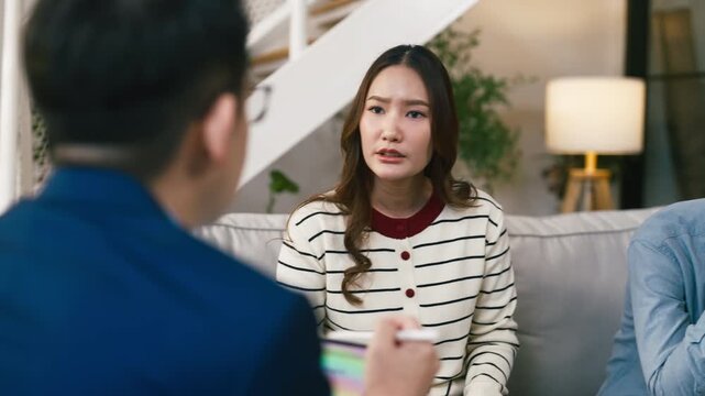 Psychologist meeting married couple for relationship therapy, supportive partner holding space during counseling discussion, emotional healing, communication improvement and professional consultation	