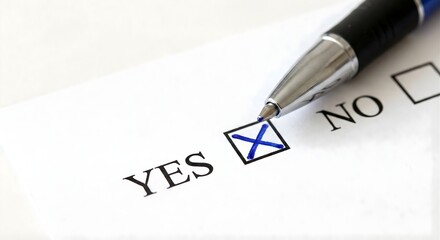A close up view of a blue pen checking a box next to the word yes on a white paper, indicating a positive selection or agreement, with no option visible in background