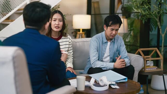 couples therapy session, a marriage counselor consults with a young couple for family therapy, offering relationship counseling, marriage help, family support, anxiety therapy, depression support	