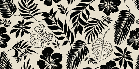 Black tropical leaves and hibiscus flowers on a beige background
