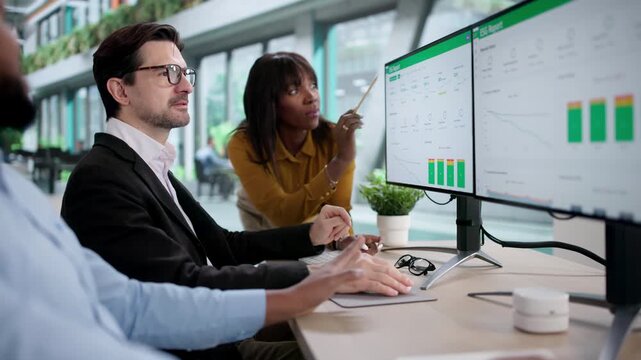 Environmental Lawyer Team Reviewing ESG Report Dashboard