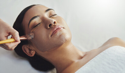 Facial, clay mask and woman in spa for skincare treatment, hydration and wellness at resort. Salon,...