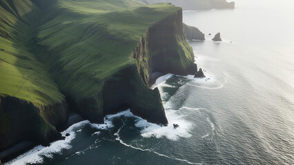 Dramatic green cliffs meeting ocean waves in stunning natural landscape