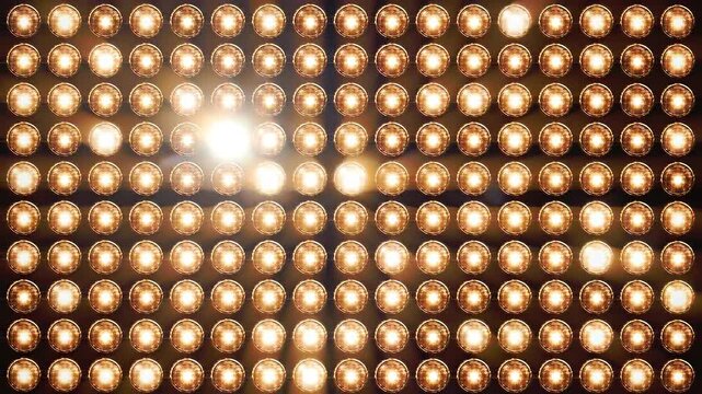 Panning shot of stage light wall with glowing golden bulbs for entertainment background 3D video