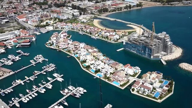 Aerial panoramic view of Limassol Marina and luxury waterfront villas in Cyprus. Oil and stock transportation through Ocean. strategic location 
