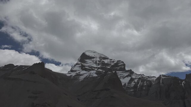 Cinematic Drone flight over Holy Mount Kailash peak and rugged landscape in Tibet, spiritual Himalaya pilgrimage 4K