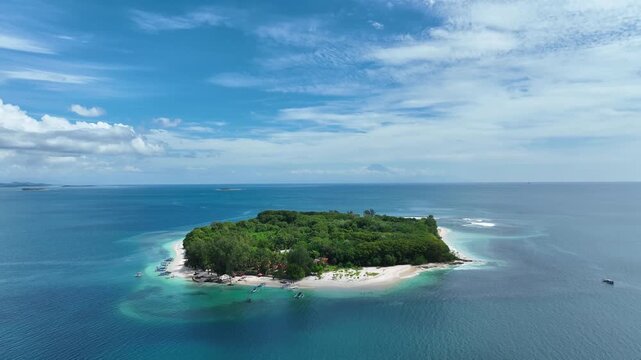 A smooth drone shot establishing secluded atoll, hidden gem in paradise of Gili islands, Indonesia. 4k