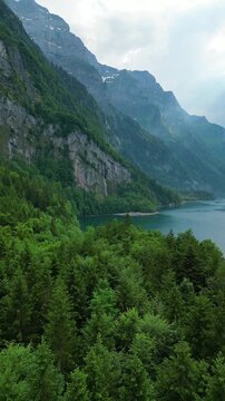 Kl&ouml;ntalersee Lake Kl&ouml;ntal Glarus Alps nature highlands Switzerland aerial drone vertical reel