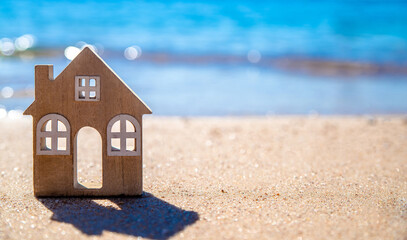 The symbol of the house standing on the seashore