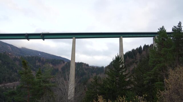 Europa Bridge in Innsbruck Austria, Trucks and Cars Driving Through Alpine Mountain Transport Route
