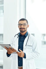 Tablet, smile and portrait of doctor in hospital with research for medical support with career....