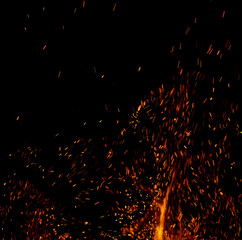 A black background with a lot of fire and smoke