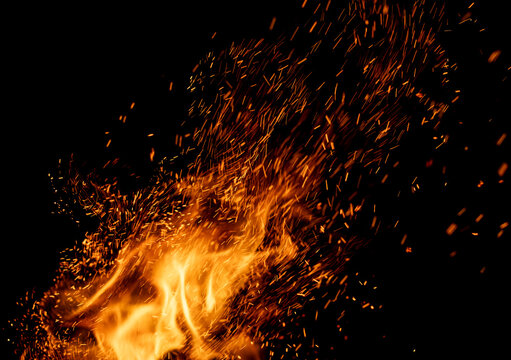 A fire with a lot of sparks flying out of it