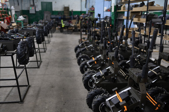 Armed military ground drone in the factory. Production of rodtized complex delivers mine.