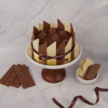 Delicious Coco Brick Choco dessert featuring a rich chocolate flavor presented in a unique brick-style shape. This indulgent sweet treat combines creamy chocolate texture with a dense layered dessert 