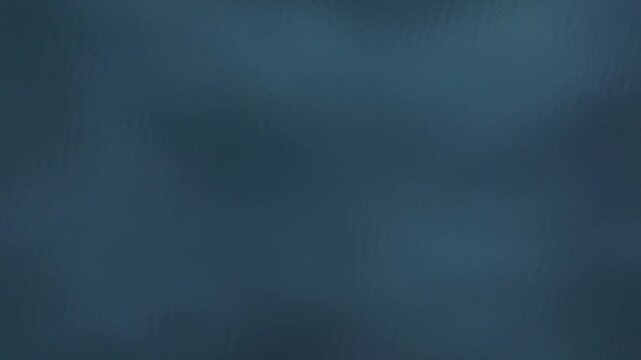 Slowly flaying overtop of dark water