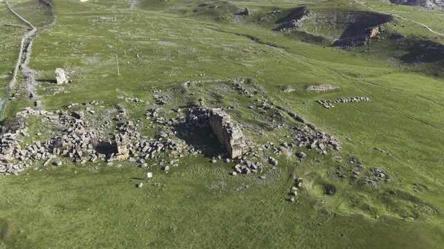 Cinematic aerial drone video of Tripolis Antik Kenti near Buldan in Denizli, Turkey, featuring Roman ruins, columns, stone structures, and panoramic scenic landscape from above.