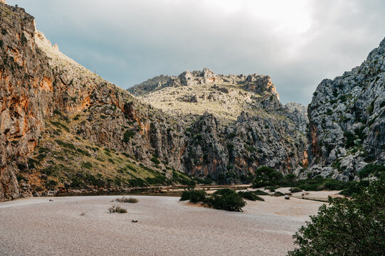 Dramatic limestone mountains and dry riverbed in Torrent de Pareis