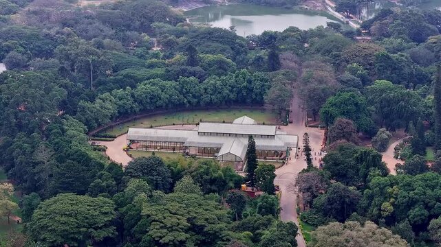 Drone view of Lalbagh Botanical Garden Bengaluru highlighting historic Glass House amidst greenery