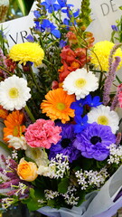 Obraz premium Colorful artificial flowers on display in a flower shop
