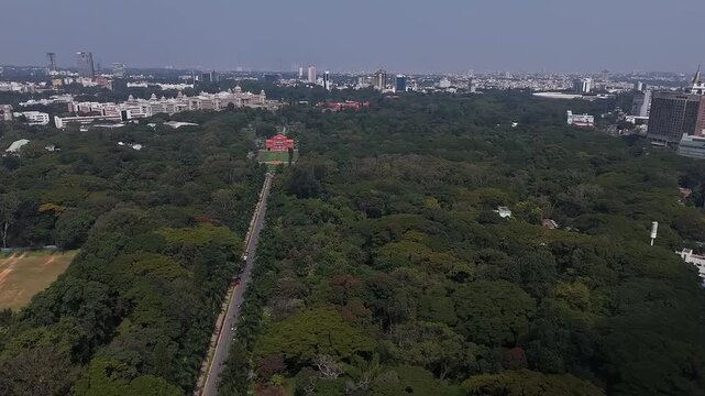 Aerial view of long road amid large trees leading to memorial hall in Cubbon Park