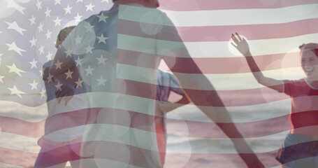 Naklejka premium Gathering five adults in casual beachwear dancing at sunset beach, with American flag overlay