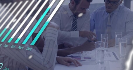 Reviewing team in business attire leaning and pointing at meeting table with charts, teal overlay