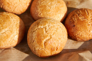 Naklejka premium Golden Brown Homemade Cookies on Parchment Paper 