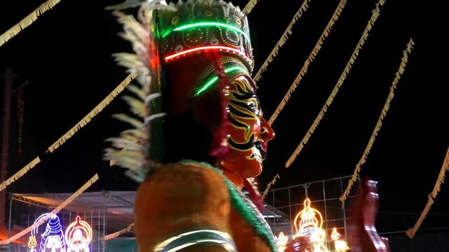 Colorful religious and cultural sculptures displayed in the 'Kavadi' procession of a temple festival in Kerala, India	