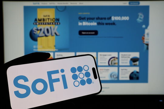 Kiel, Germany - 03-06-2026: Smartphone displaying US financial services company SoFi logo in front of companys webpage