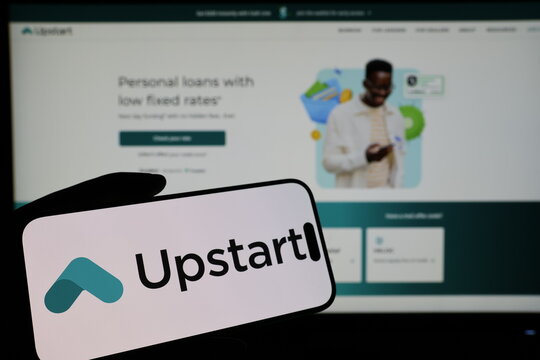Kiel, Germany - 03-06-2026: Smartphone displaying US lending technology company Upstart logo in front of companys webpage
