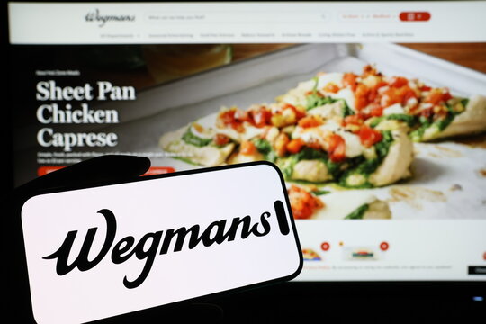 Kiel, Germany - 03-06-2026: Smartphone displaying US supermarket company Wegmans Food Market logo in front of companys webpage