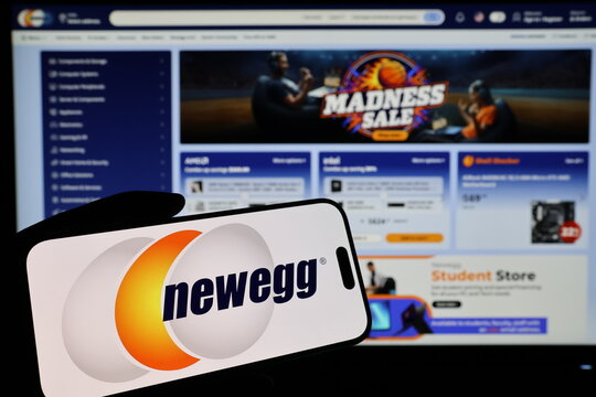 Kiel, Germany - 03-06-2026: Smartphone displaying US electronics retailer Newegg logo in front of companys webpage