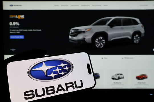 Kiel, Germany - 03-06-2026: Smartphone displaying Japanese automobile company Subaru logo in front of companys webpage