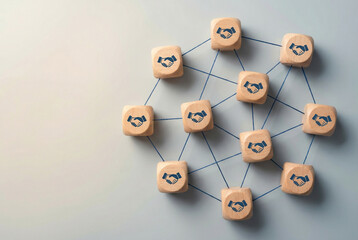 Obraz premium Interconnected wooden blocks printed with handshake icons form visual business network illustrating partnership, collaboration, trust an teamwork across nodes, links for corporate, networking strategy