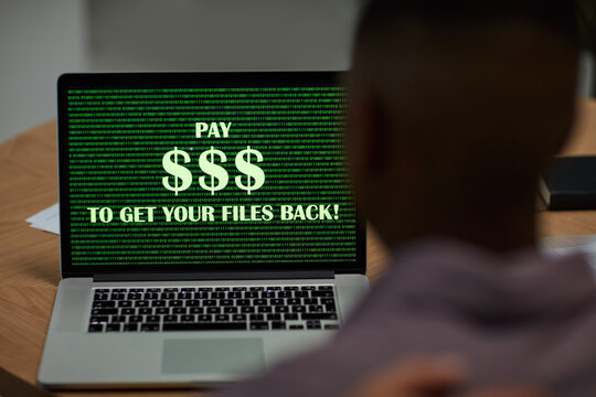 Virus, laptop screen and business man with system error, ransom and malware in office. Cyber security, password issue and ransomware with threat, spam with computer in workplace with tech trouble