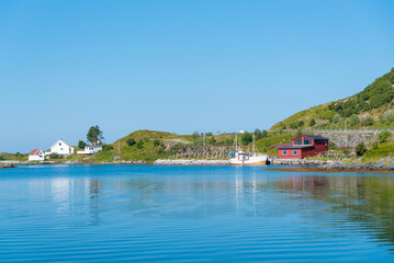 Obraz premium Coastal landscape with a traditional fisherman’s cabin near Ramberg. Lofoten island in Norway.