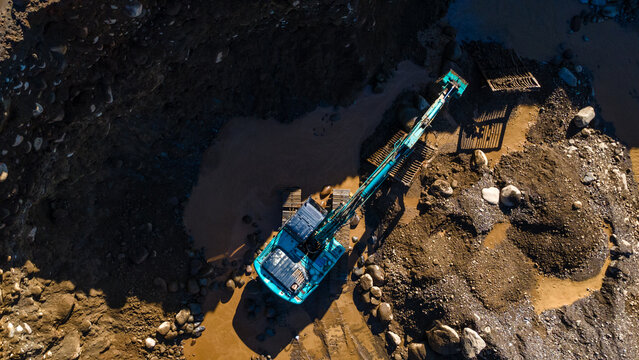 Excavator in Quarry. Mining Operation with Heavy Machinery in Open Pit Quarry, Mining Site View from Above