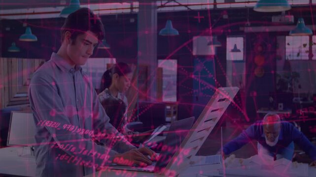 Man typing at desk initiating magenta overlay while colleagues arranging plans for design review